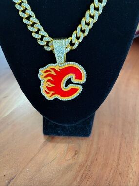 Iced Out Calgary Flames Pendant with Gold Tone Necklace